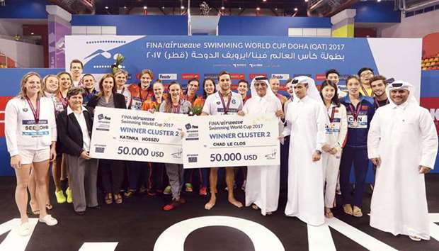 Swimmers pose with Qatar Swimming Association President Khaleel al-Jabir after the conclusion of the FINA Swimming World Cup at the Hamad Aquatic Centre yesterday. PICTURE: Noushad Thekkayil