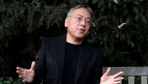 Author Kazuo Ishiguro speaks to the media outside his home, following the announcement that he has won the Nobel Prize for Literature, in London.