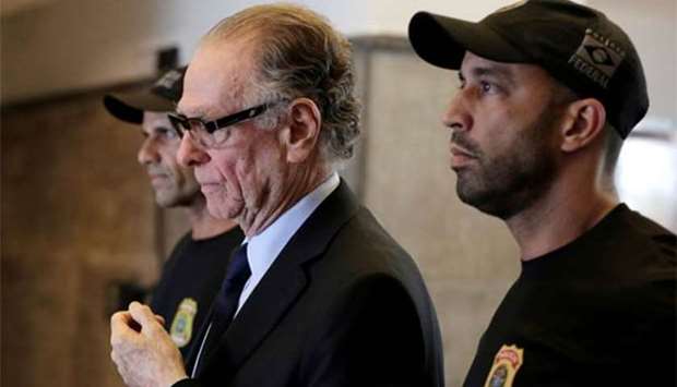 Brazilian Olympic Committee President Carlos Nuzman leaves the federal police headquarters heading to jail, in Rio de Janeiro on Thursday.