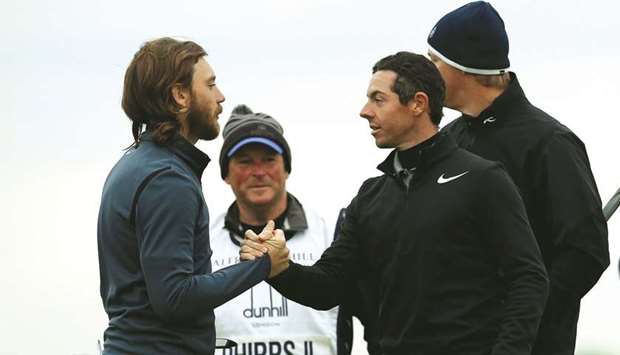 Northern Irelandu2019s Rory McIlroy shakes hands with Englandu2019s Tommy Fleetwood after their second round at Alfred Dunhill Links Championship in Carnoustie,Scotland, yesterday. (Reuters)