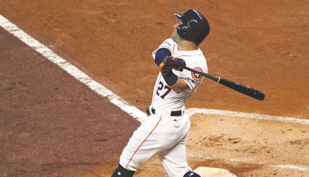 Houston Astros second baseman Jose Altuve hits a solo home-run during the game one of the 2017 ALDS playoff baseball series against Boston Red Sox at Minute Maid Park in Houston, Texas, on Thursday. (USA TODAY Sports)