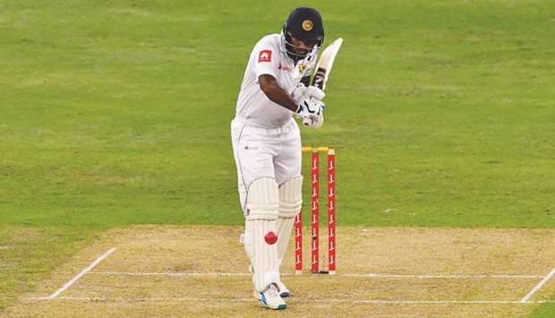 Dimuth Karunaratne of Sri Lanka plays a shot at the Dubai International Stadium in Dubai yesterday.