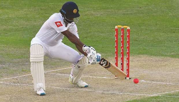 Dimuth Karunaratne of Sri Lanka plays a shot on second day of the second Test against Pakistan in Dubai yesterday. (AFP)
