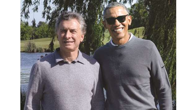 Argentine President Mauricio Macri (left) and former US President Barack Obama meeting at the Golf Club Buenos Aires, in Bella Vista, yesterday.