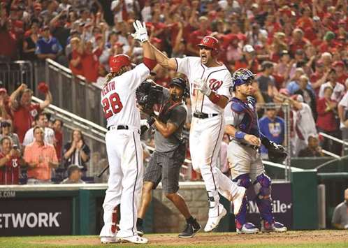 Washington Nationals first baseman Ryan Zimmerman celebrates with Washington Nationals left fielder Jayson Werth (left) after his 3-RBI home run during the eighth inning in game two of the 2017 NLDS against the Chicago Cubs at Nationals Park. (USA TODAY Sports)