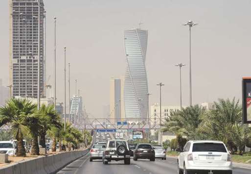 Saudi commuters drive down a main street in the capital Riyadh. The kingdomu2019s economy has shrunk for two quarters in a row this year.