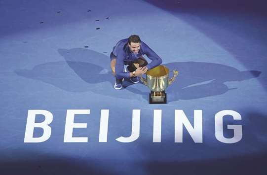 Rafael Nadal of Spain poses with the trophy after winning the final against Nick Kyrgios of Australia at the China Open in Beijing yesterday. (AFP)