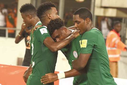 Nigeriau2019s Alex Iwobi (centre) celebrates after scoring the winner against Zambia during the World Cup qualifying match in Uyo, Akwa Ibom State, on Saturday night. (AFP)
