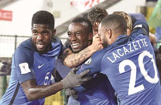 Franceu2019s midfielder Blaise Matuidi (centre) celebrates with teammates after scoring against Bulgaria during the FIFA World Cup 2018 qualifying match at The Vasil Levski Stadium in Sofia, Bulgaria, on Saturday night. (AFP)