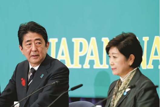 Japanu2019s Prime Minister Shinzo Abe, who is also ruling Liberal Democratic Party leader, and Head of Japanu2019s Party of Hope and Tokyo Governor Yuriko Koike attend a debate session ahead of October 22 lower house election at the Japan National Press Club in Tokyo, Japan.