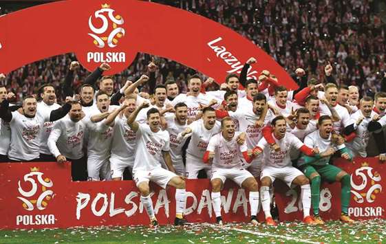 Poland celebrate their qualification for the World Cup.