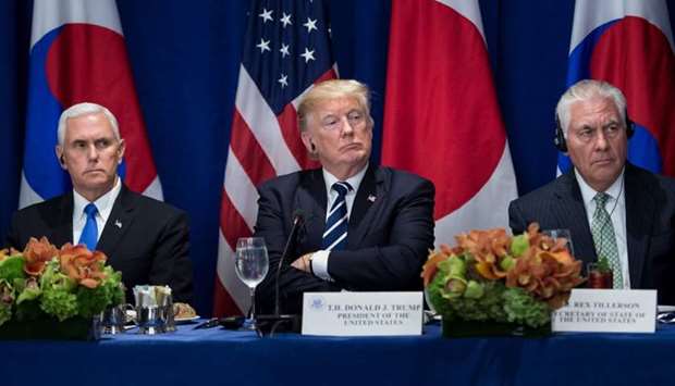 US Vice President Mike Pence (L), US President Donald Trump (C), and US Secretary of State Rex Tillerson listen to statements before luncheon with US, Korean, and Japanese leaders at the Palace Hotel during the 72nd United Nations General Assembly in New York City.  File photo: September 21, 2017.