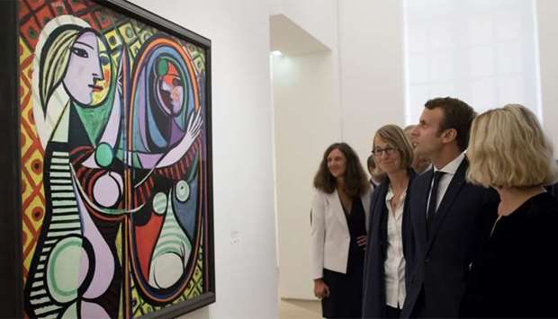 French President Emmanuel Macron (2ndR) and French Culture Minister Francoise Nyssen ((3rdR) view Pablo Picasso's 1932 ,Girl before a mirror,
