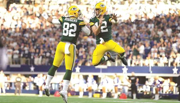 Green Bay Packers quarterback Aaron Rodgers (right) celebrates with tight end Richard Rodgers after scoring the winning touchdown at AT&T Stadium. PICTURE: USA TODAY Sports
