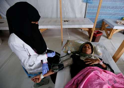A nurse attends to cholera-infected Safaa Kaheel Essa, 37, at a treatment centre in the Red Sea port city of Hodeidah, Yemen.