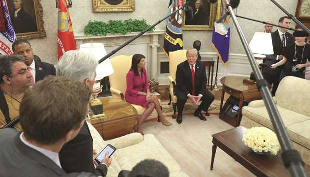 Trump with Haley in the Oval Office of the White House after it was announced that the president had accepted her resignation.