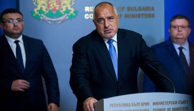 Bulgarian Prime Minister Boyko Borisov (C) speaks during a joint news conference with Bulgarian Interior Minister Marin Marinov (L) and Bulgaria Prosecutor General Sotir Tsatsarov (R) in Sofia.