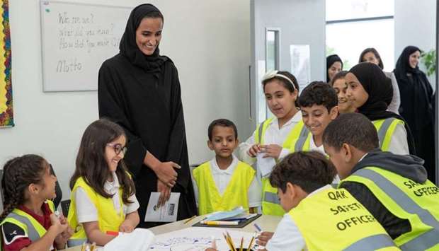 HE Sheikha Hind bint Hamad al-Thani observes the activities of the students.rn