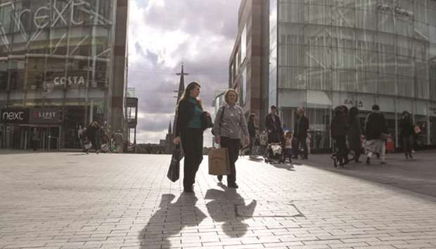 Shoppers pass an area close to the Bullring shopping centre in Birmingham. The UKu2019s GDP grew 0.7% in the three months through August, the Office for National Statistics said.