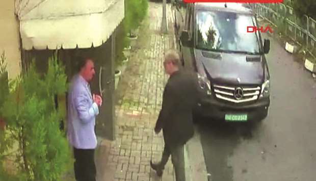 This video grab shows Saudi journalist Khashoggi (R) arriving at the Saudi Arabian consulate in Istanbul on October 2. Khashoggi, a Washington Post contributor, vanished on October 2 after entering the consulate to obtain official documents ahead of his marriage to his Turkish fiancee. AFP/DHA