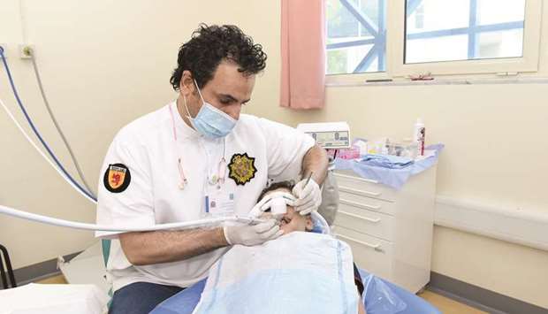 A patients being treated at the dental clinic.