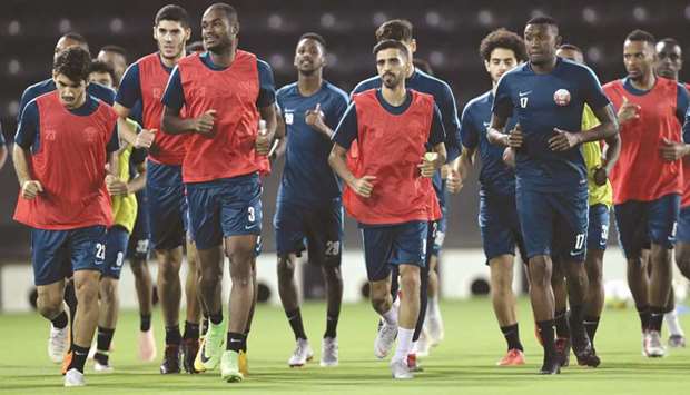 Qatar players take part in a training session at Al Sadd Sports Club on the eve of the international friendly against Ecuador yesterday.