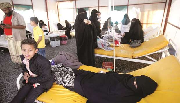 Yemeni cholera patients lie in bed at the Al-Sabeen hospital in Sanaa yesterday.