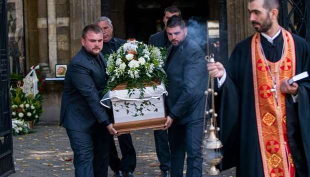 People carry the coffin of killed Bulgarian journalist Viktoria Marinova in Holy Trinity Cathedral in Ruse, North East Bulgaria.