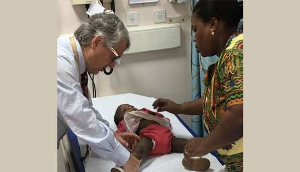 Dr Salle examines a child with the malformation