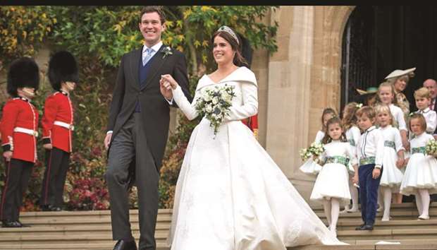 Princess Eugenie of York and her husband Jack Brooksbank emerge from the West Door of St Georgeu2019s Chapel, Windsor Castle, in Windsor, yesterday after their wedding ceremony.