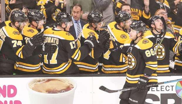 Boston Bruins left wing David Pastrnak (right) celebrates his goal with his teammates during the game against the Detroit Red Wings at TD Garden in Boston, Massachusetts, on Saturday. (USA TODAY Sports)