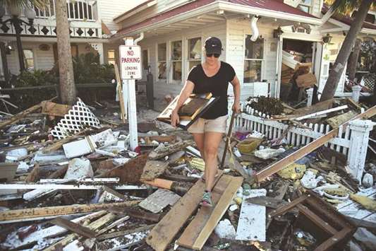 Brandy Jessen helps recover belongings from her motheru2019s house damaged by Hurricane Michael in Mexico Beach, Florida.