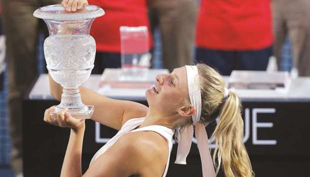 Dayana Yastremska of Ukraine celebrates with the trophy after winning the Hong Kong Open yesterday. (AFP)