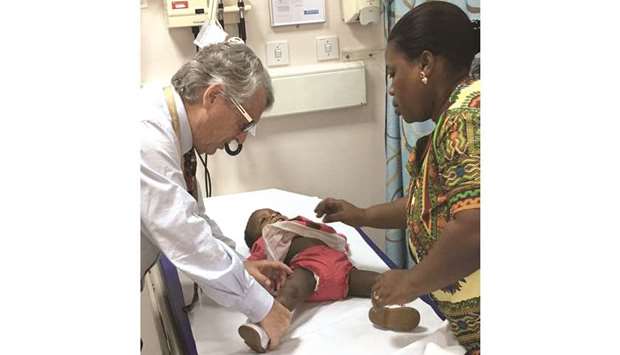 Dr Salle examines a child with the malformation.