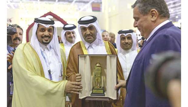Qatar Racing and Equestrian Club (QREC) chairman Issa bin Mohamed al-Mohannadi (centre) and QREC general manager Nasser bin Sherida al-Kaabi (left) present a memento to Moroccou2019s Minister for Agriculture and Maritime Fisheries, Aziz Akhannouch (right), during the inauguration of Salon du Cheval in El Jadida, Morocco, yesterday.