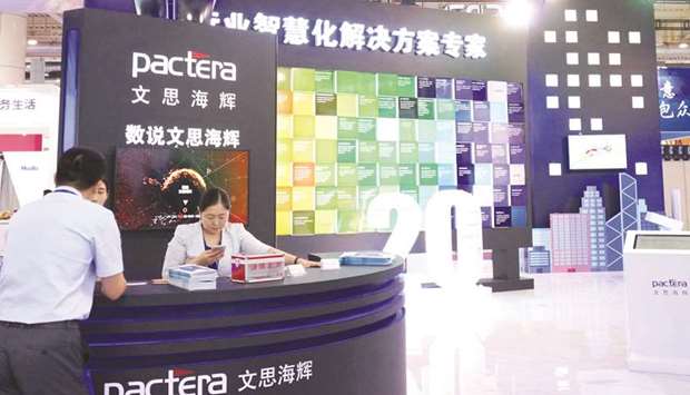 A booth of HNA Groupu2019s IT outsourcing unit Pactera is seen at a trade fair in Liaoning province, China. Beijing-based Pactera, which has struggled with its finances, caused a stir last year when Goldman Sachs suspended early-stage work on its US IPO after the deal did not pass the banku2019s internal due diligence standards.