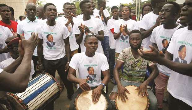 Supporters of former president Henri Konan Bedie play music ahead of a meeting of the Parti Democratique de la Cote du2019Ivoire (PDCI) in Daoukro, Ivory Coast.