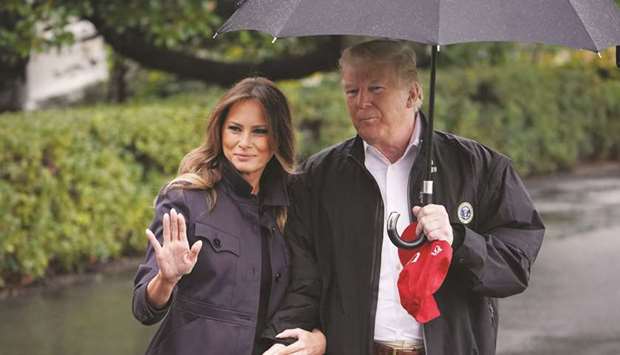 US President Donald Trump and First Lady Melania Trump make their way yesterday to board Marine One from the South Lawn of the White House in Washington, DC.