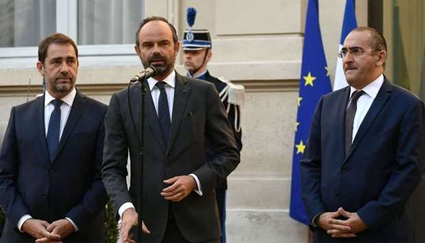 French Prime minister Edouard Philippe (C) flanked by newly appointed French Interior minister Christophe Castaner (L) and newly appointed French Secretary of State to the Interior Minister Laurent Nunez