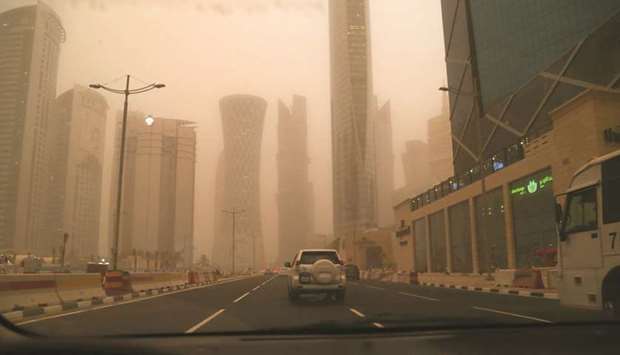 A dust-shrouded West Bay in Doha yesterday. PICTURE: Jayan Orma