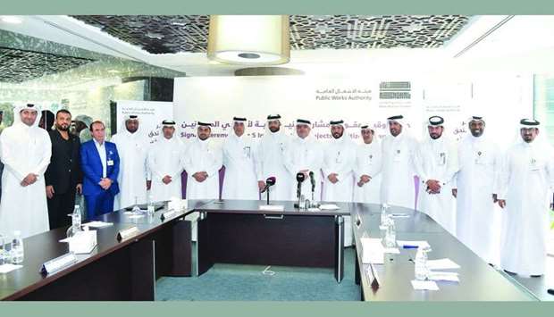 Ashghal president Saad bin Ahmed al-Muhannadi and other officials with representatives of the companies who were awarded contracts for building infrastructure in the citizens' sub-divisions projects. PICTURE: Noushad Thekkayil