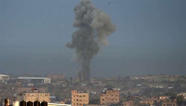 Smoke billows following an Israeli air strike around the southern Gaza Strip city of Rafah