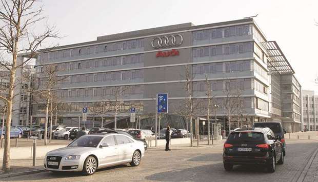 Traffic passes the Audi headquarters in Ingolstadt, Germany. In a statement, Volkswagen said Audi had agreed to pay an u20ac800mn ($927mn) fine issued by Munich prosecutors.