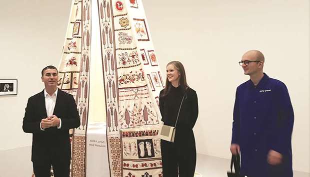 From left: Abdellah Karroum, Laura Barlow and Hendrik Folkerts showcasing the embroideries made by Mounira al-Solh. PICTURE: Joey Aguilar