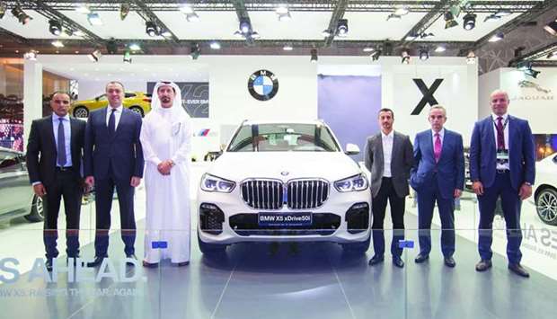 Alfardan Group board member Fahad Alfardan (3rd, left), Alfardan Automobiles general manager Rabih Ataya (2nd, right) and BMW Group Middle East Ayser Maan (3rd, right), along with other Alfardan Automobiles officials at the unveiling of BMW X5 at the Qatar Motor Show 2018. -supplied picture