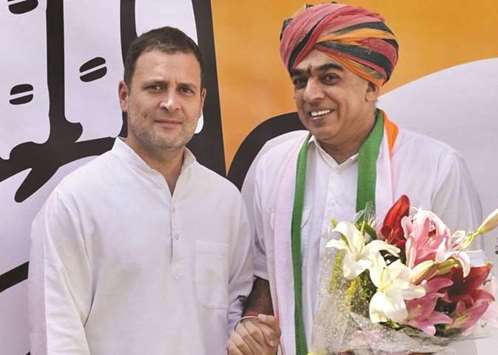 Manvendra Singh shakes hands with Rahul Gandhi after he joined the Congress, in New Delhi yesterday.