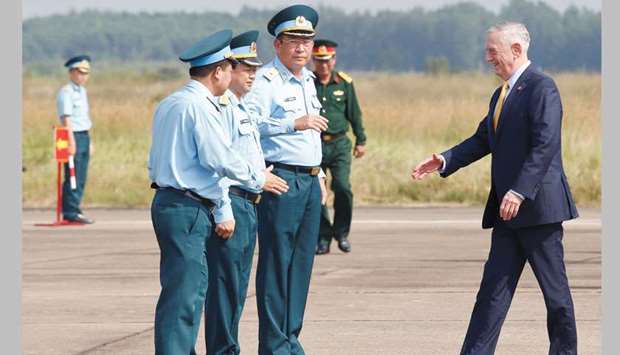 US Secretary of Defence Jim Mattis, right, is greeted by Vietnamu2019s Air Force Deputy Commander General Bui Anh Chung (second right) while he visits Bien Hoa airbase, outside Ho Chi Minh city, yesterday.
