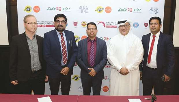 Ali al-Hitmi (second left), Executive Director of the Organising Committee of the Artistic Gymnastics World Championships, poses with the representatives of the sponsors at an agreement signing ceremony yesterday.