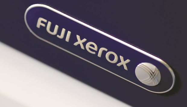 The Fuji Xerox logo is seen on a photocopier in this illustration photo. Fujifilm is suing Xerox in a separate US suit that seeks well over $1bn, accusing it of breach of contract in abandoning the deal.