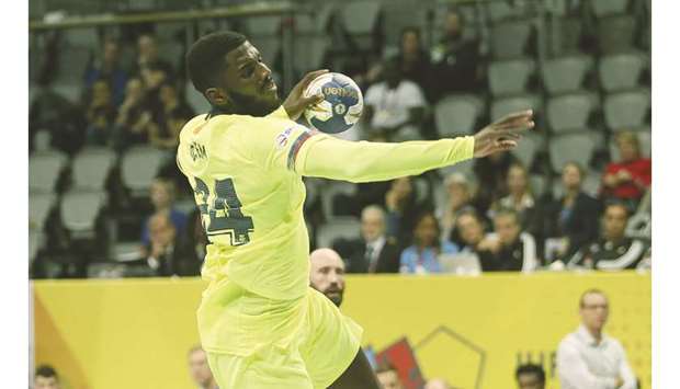 Barcelonau2019s Dika Akwa Mem in action during the IHF Super Globe semi-final against Montpellier at Duhail Sports Hall yesterday. Mem scored six goals in his teamu2019s 37-30 win. PICTURES: Anas Khalid
